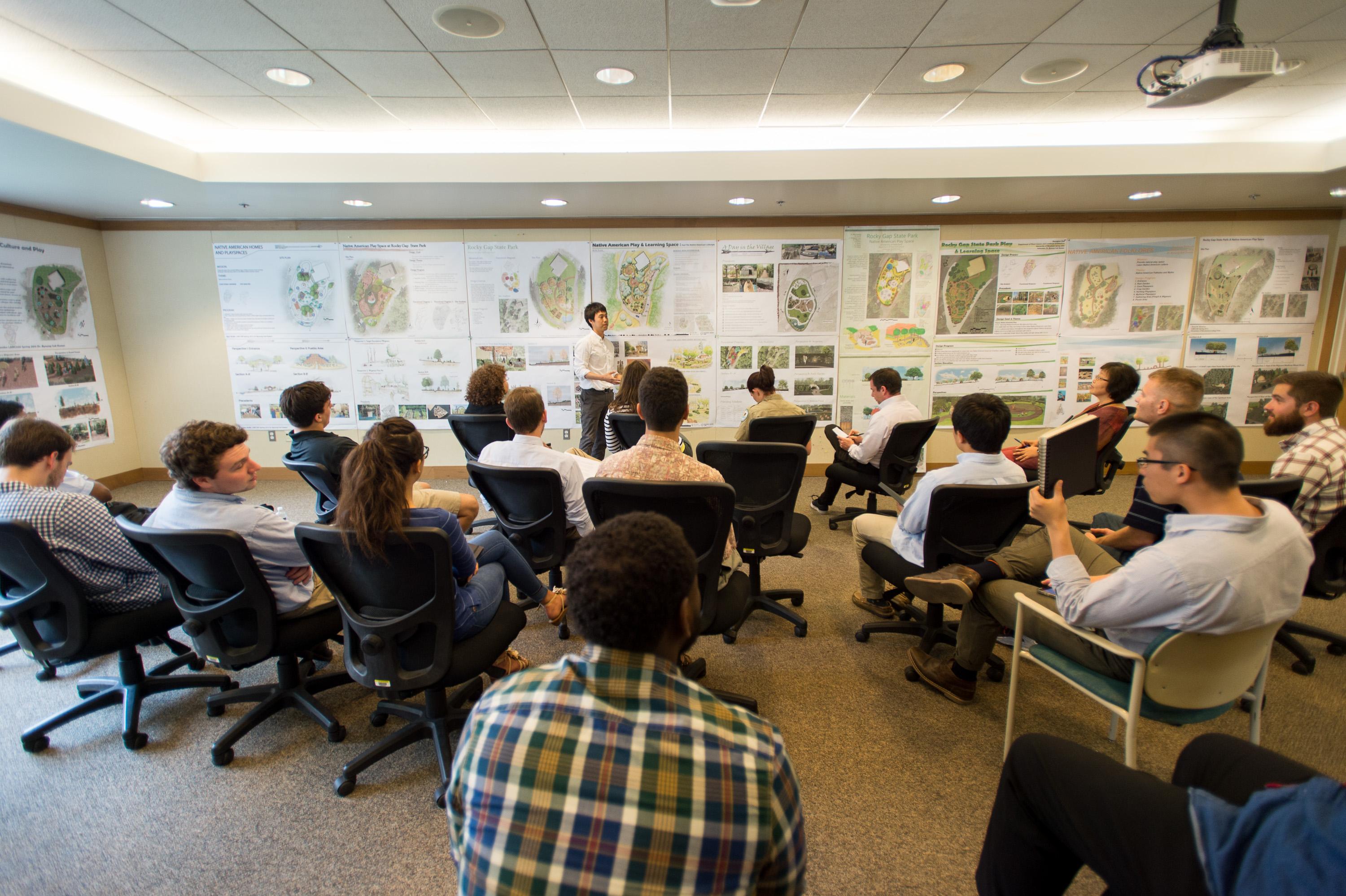 Students presenting their designs to class.